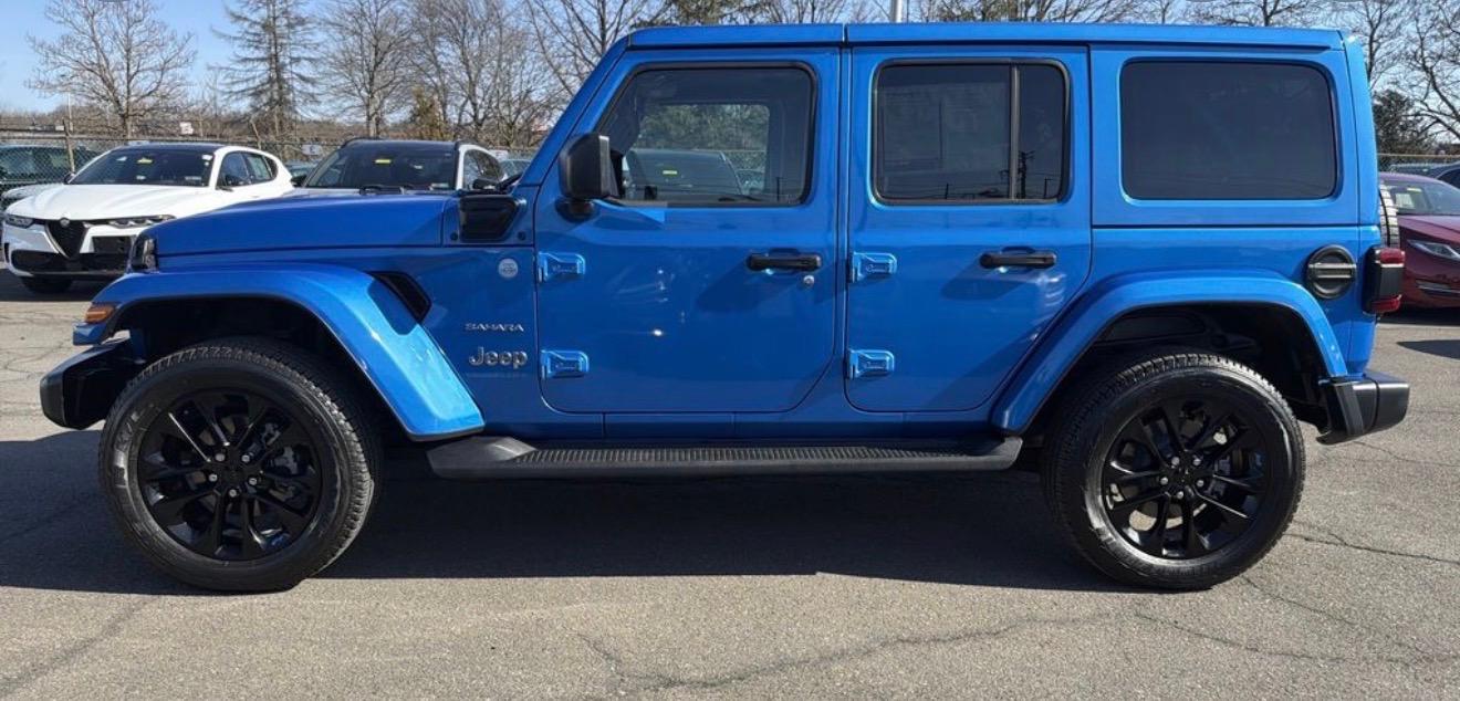 A DrivePrime Cars rental — blue Jeep Wrangler 4xe on the lot in Charlotte